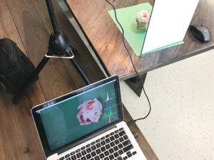 Photo of photography setup with laptop and ice cream